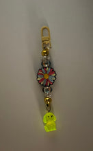 Load image into Gallery viewer, Pink and blue daisy Charm with glow in the dark dog